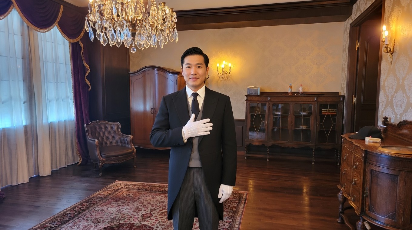 THE BUTLER services. A formal butler standing ready to support life and business